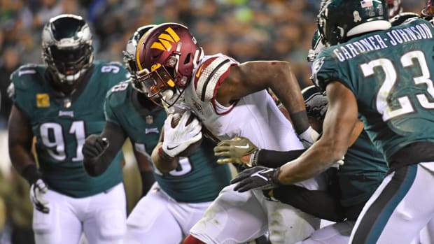 Washington Commanders running back Brian Robinson Jr. carries the ball against the Philadelphia Eagles.